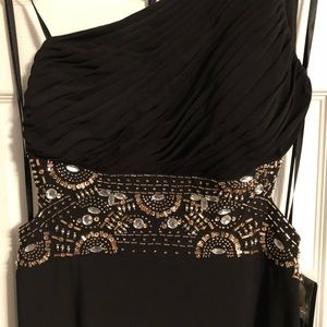 Black dress, open back.